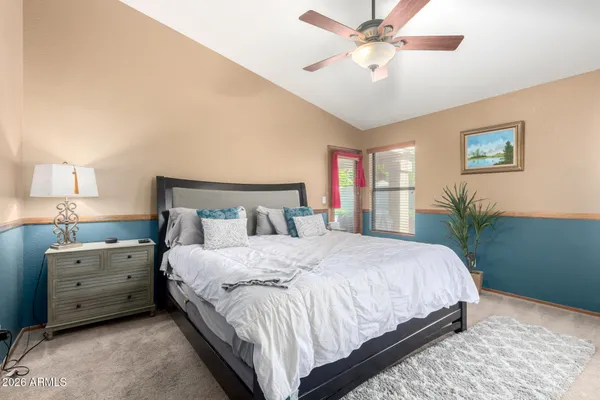 a bedroom with bed and window