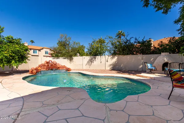a view of a swimming pool with a yard