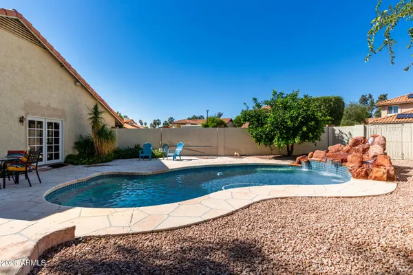 a view of a swimming pool with a patio