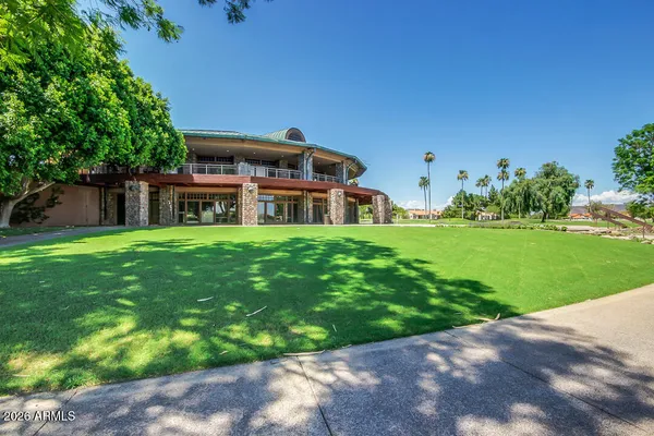 a house view with a sitting space and garden