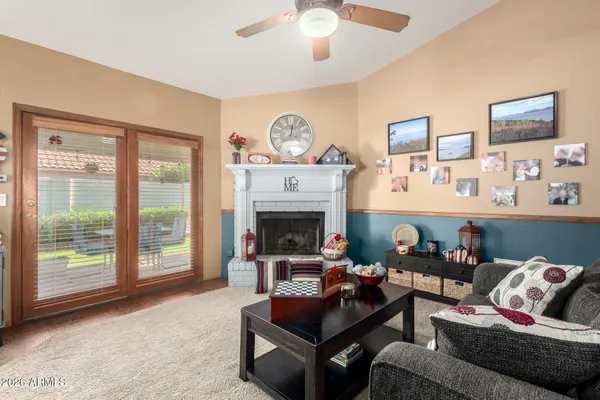 a living room with furniture and a fireplace
