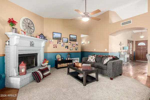 a living room with furniture and a fireplace
