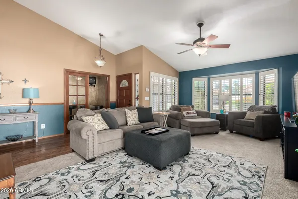 a living room with furniture and a large window