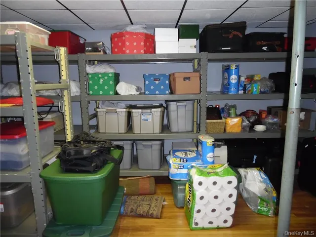 a room with lots of furniture and white walls