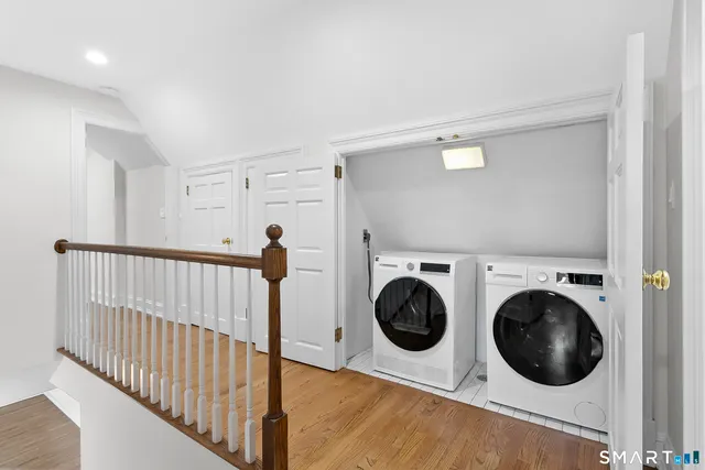 a view of a hallway with washer and dryer