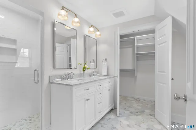 a bathroom with a granite countertop sink a mirror and a