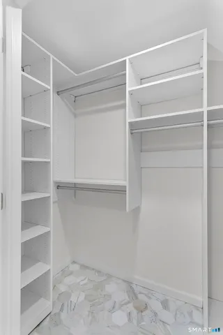 a view of an empty walk in closet