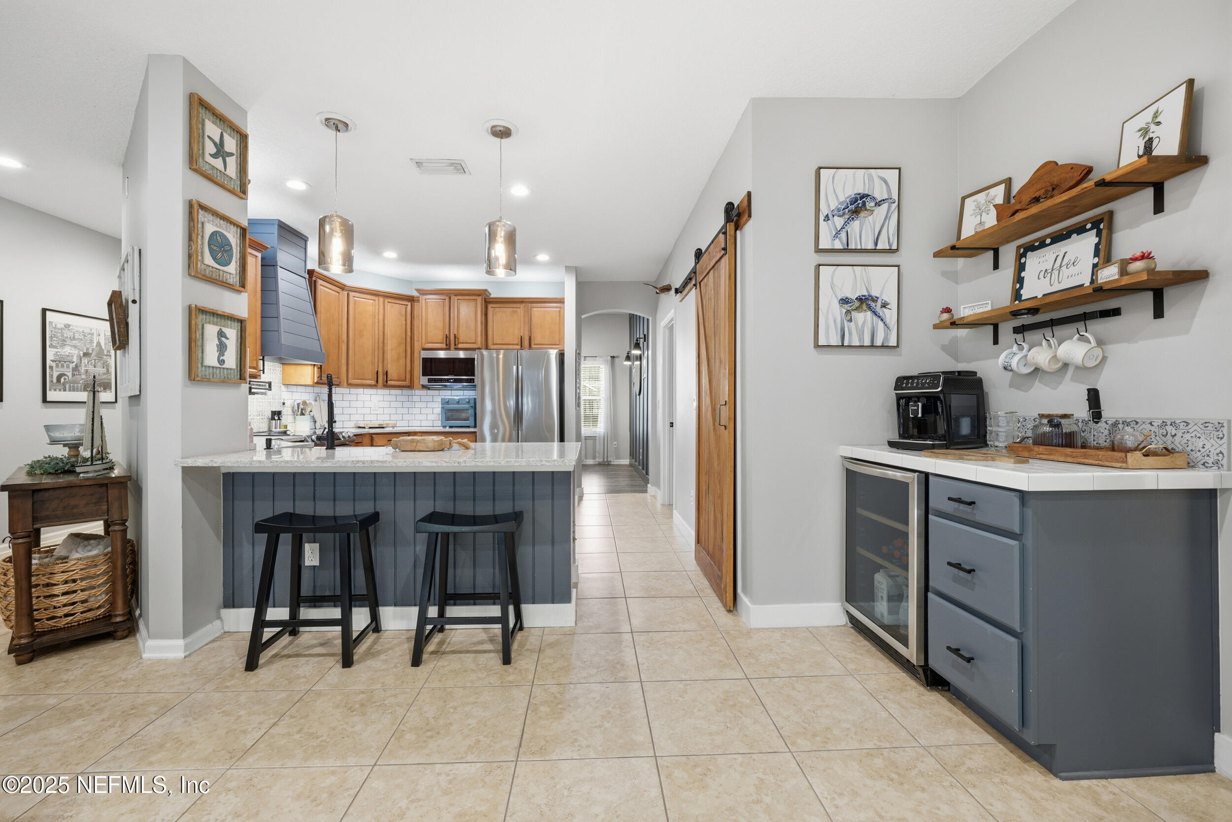 177 Summerhill Circle St. Augustine, FL 32086 - Photo 12 of 42 a kitchen with cabinets and chairs