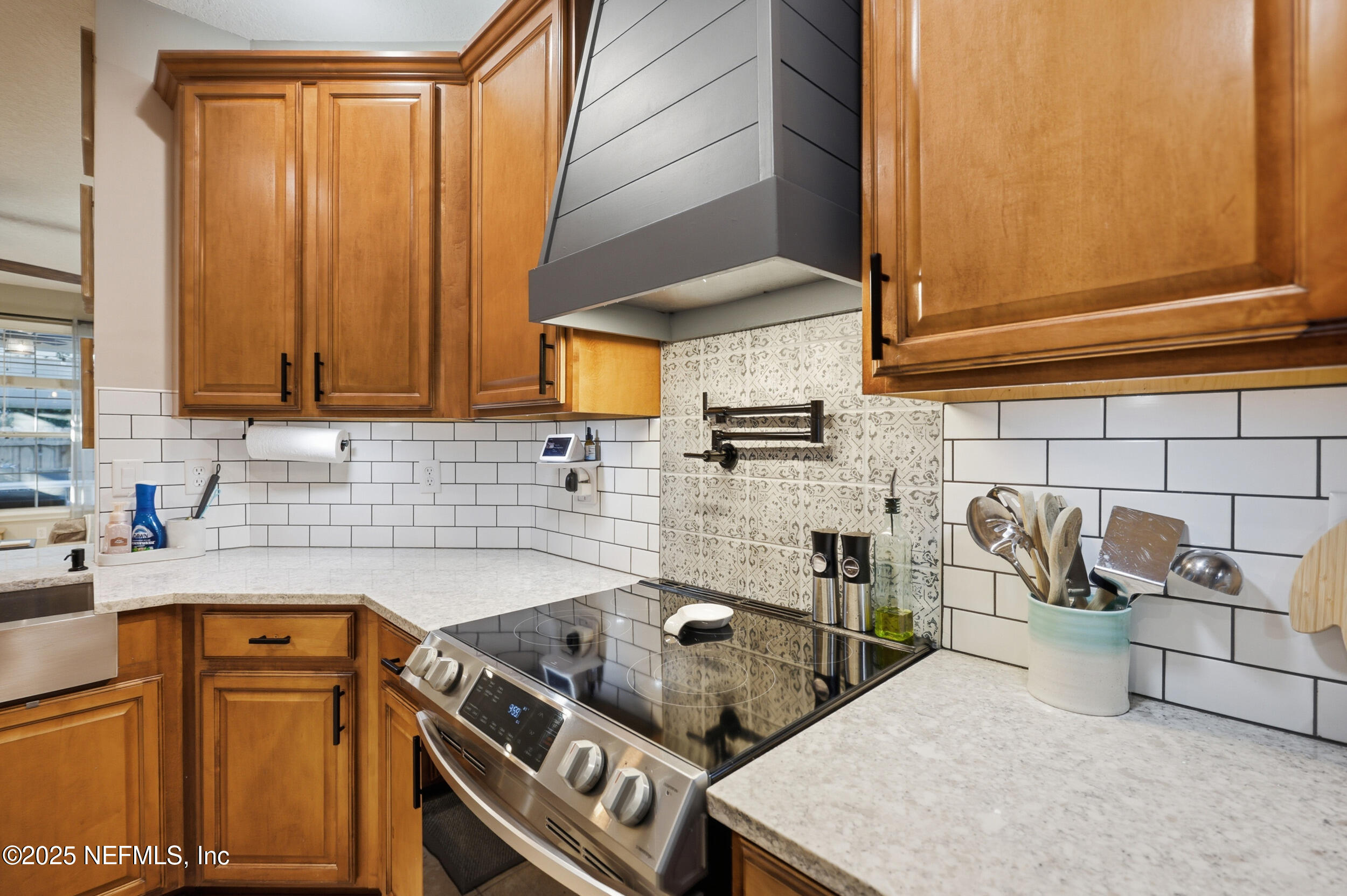 177 Summerhill Circle St. Augustine, FL 32086 - Photo 17 of 42 a kitchen with a sink a stove and cabinets