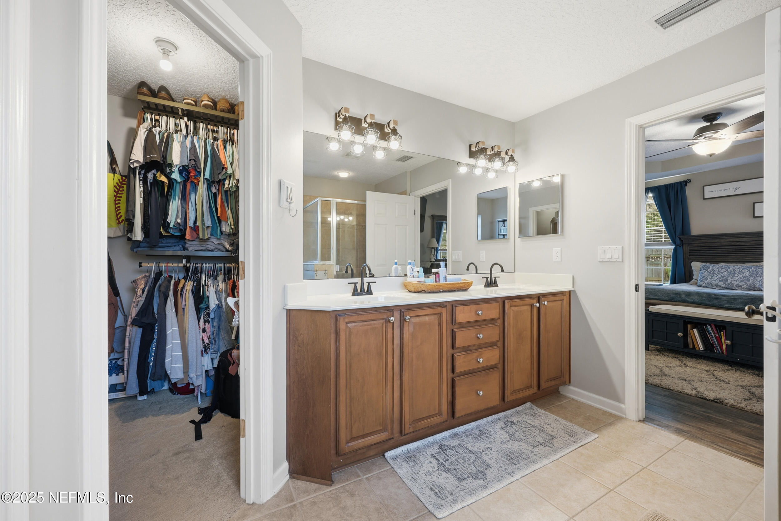 177 Summerhill Circle St. Augustine, FL 32086 - Photo 23 of 42 a bathroom with a sink and a mirror