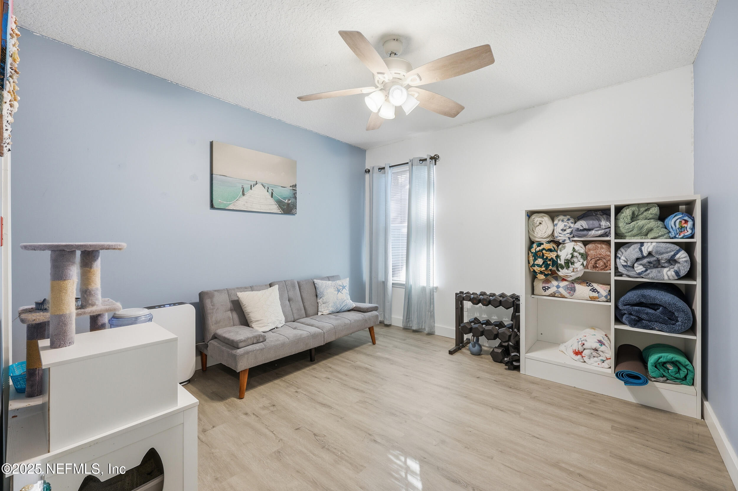 177 Summerhill Circle St. Augustine, FL 32086 - Photo 25 of 42 a living room with furniture and a fireplace