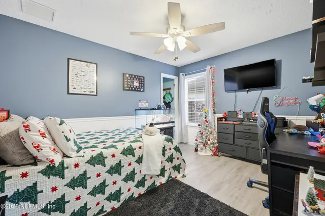 a kitchen with white cabinets and sink