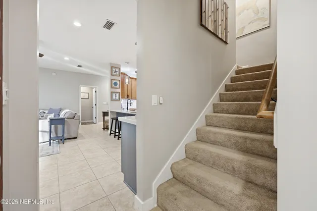 a bedroom with furniture and a chandelier