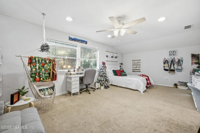 a bedroom with a bed and furniture