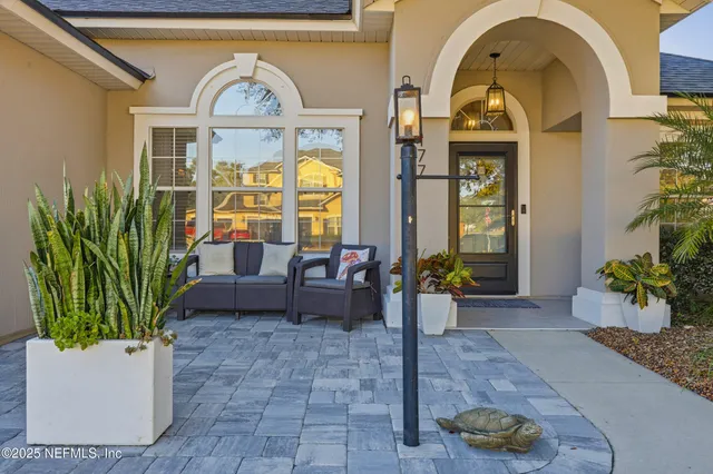 a view of a living room and entryway