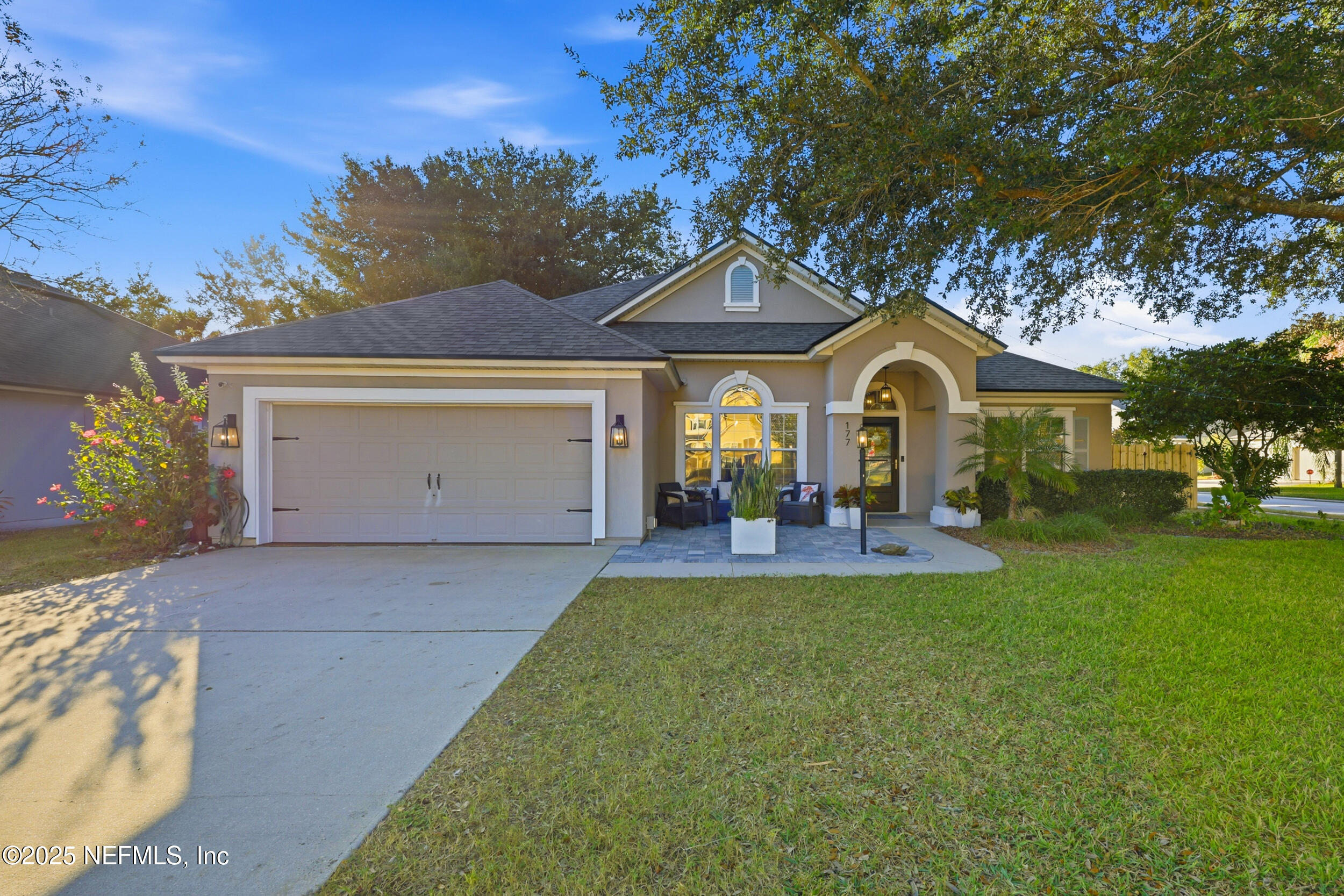 177 Summerhill Circle St. Augustine, FL 32086 - Photo 40 of 42 a view of a house with a yard and large tree