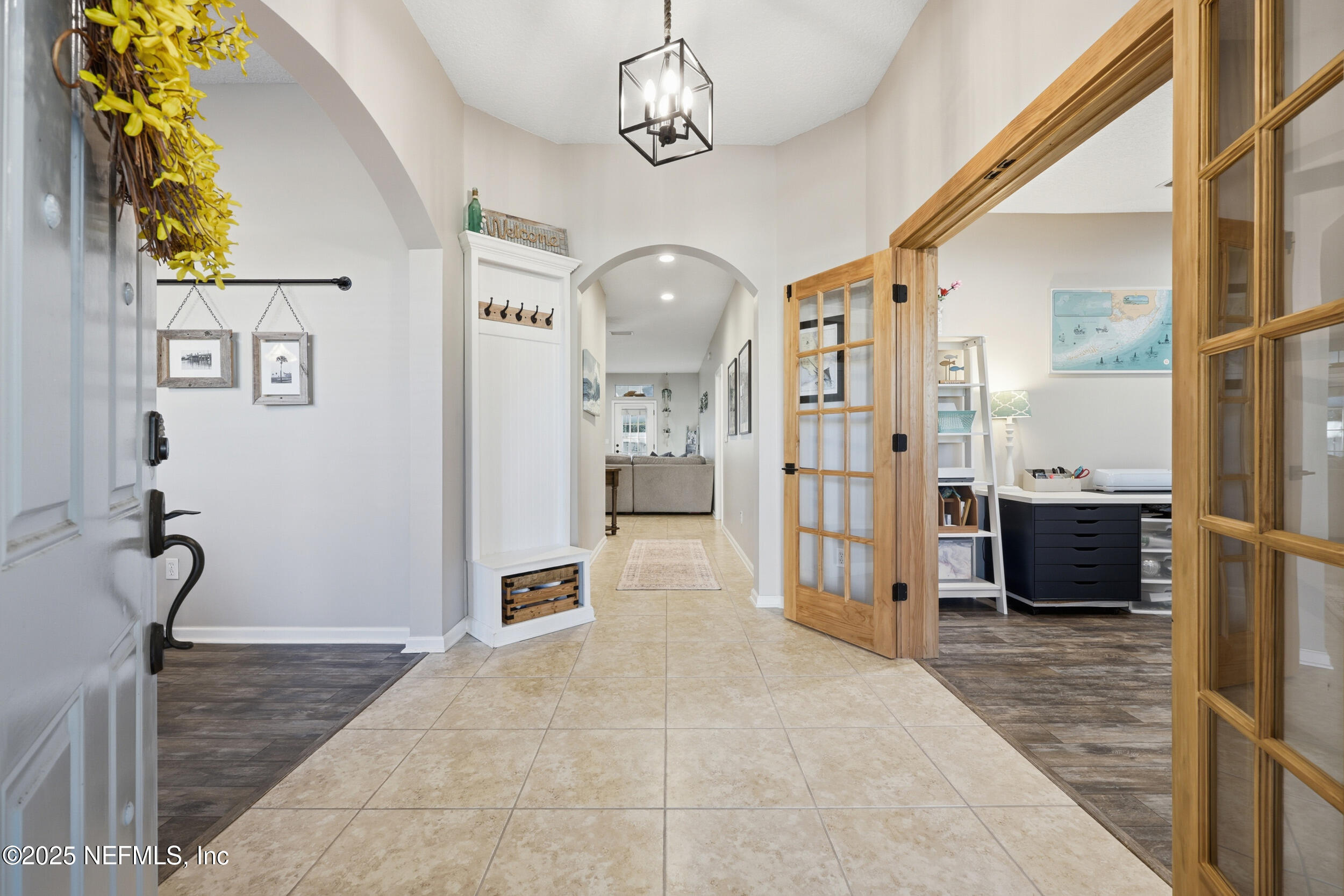 177 Summerhill Circle St. Augustine, FL 32086 - Photo 5 of 42 a view of a hallway with a chandelier