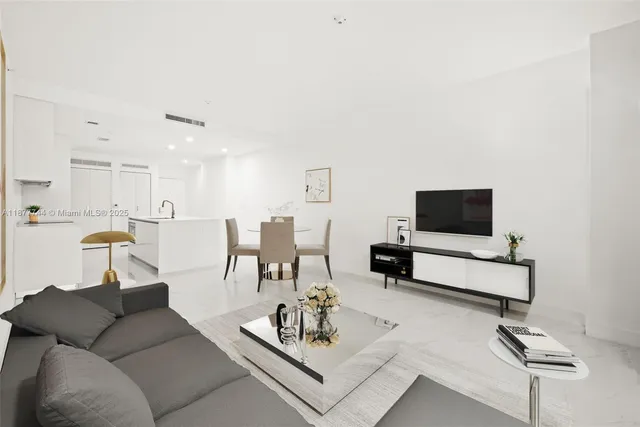 a view of a kitchen with white cabinets