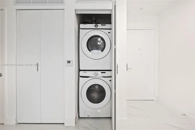 a spacious bedroom with a bed and a couch