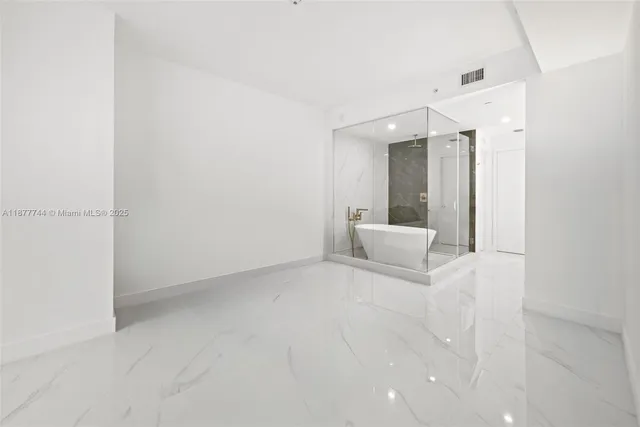 a bathroom with a shower and a toilet