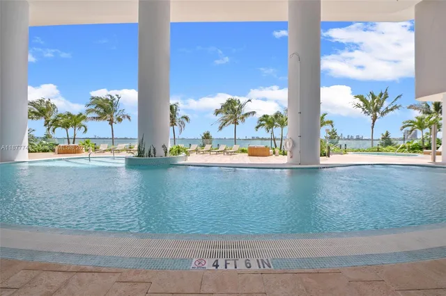 a view of a house with a yard and street