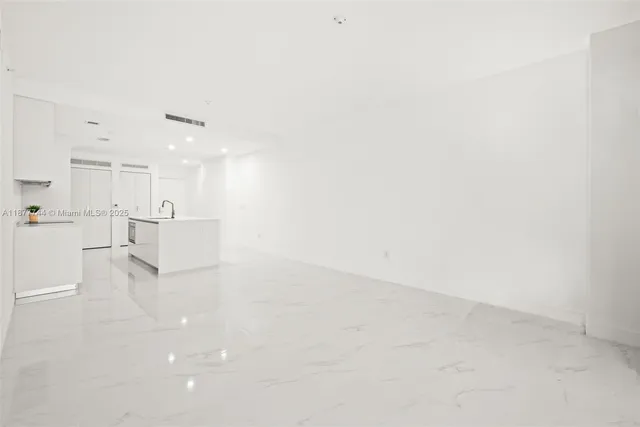 a view of a kitchen with a sink