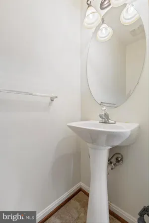 a bathroom with a sink a mirror and shower