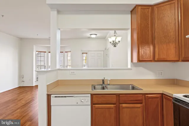 a kitchen with a sink cabinets and appliances