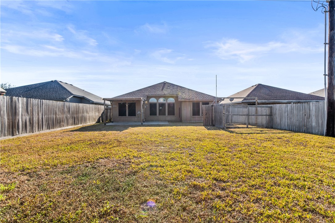 6630 Riding Wind Drive Corpus Christi, TX 78414 - Photo 32 of 40 a swimming pool with wooden fence
