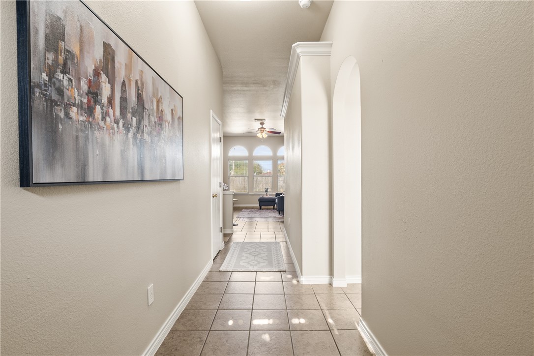 6630 Riding Wind Drive Corpus Christi, TX 78414 - Photo 5 of 40 a view of a hallway with wooden floor and a bathroom
