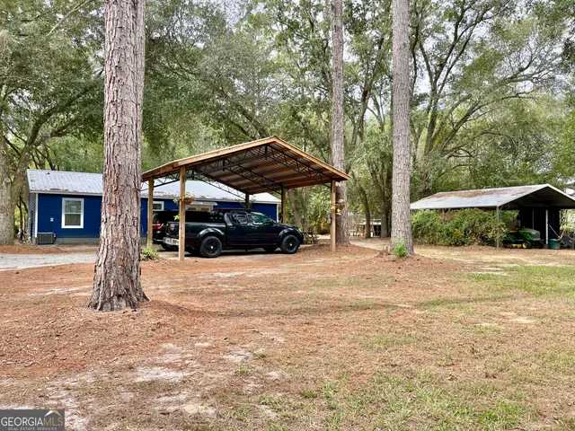a view of a road with trees