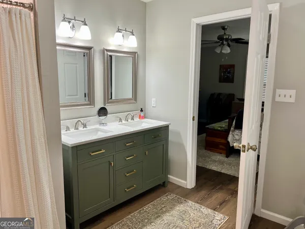 a bathroom with a shower and a sink