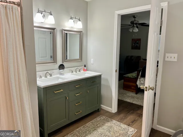 a bathroom with a shower and a sink