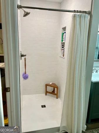 a white toilet sitting next to a bathroom sink