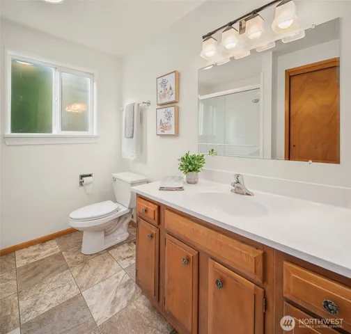 a view of a room with furniture and a window