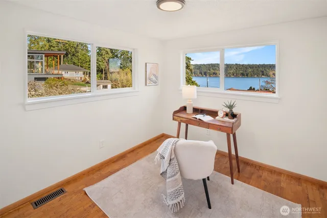 a view of living room with furniture and a rug
