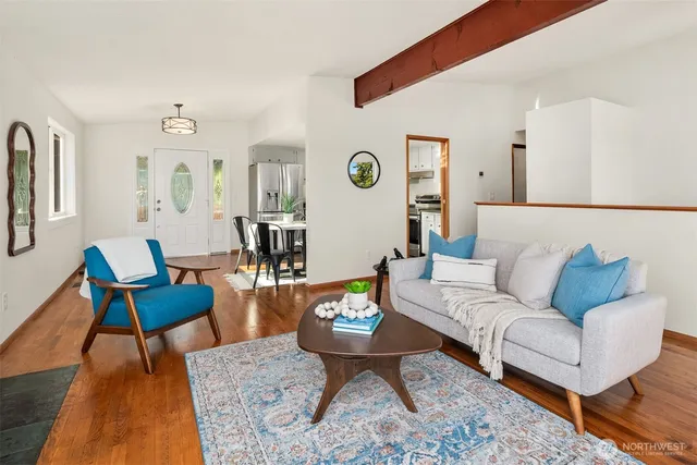 a view of a dining room with furniture window and wooden floor