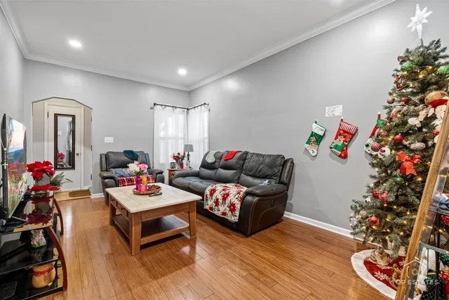 a living room with furniture and flowers