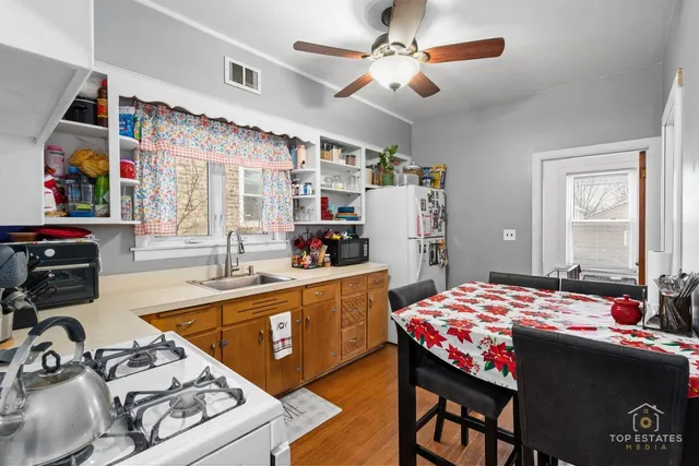 a very nice looking bedroom with a large bed a flat screen tv and a large window