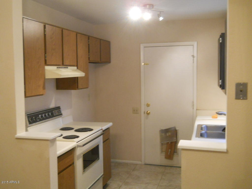 4357 East Carson Road Phoenix, AZ 85042 - Photo 7 of 21 a kitchen with a stove and a refrigerator