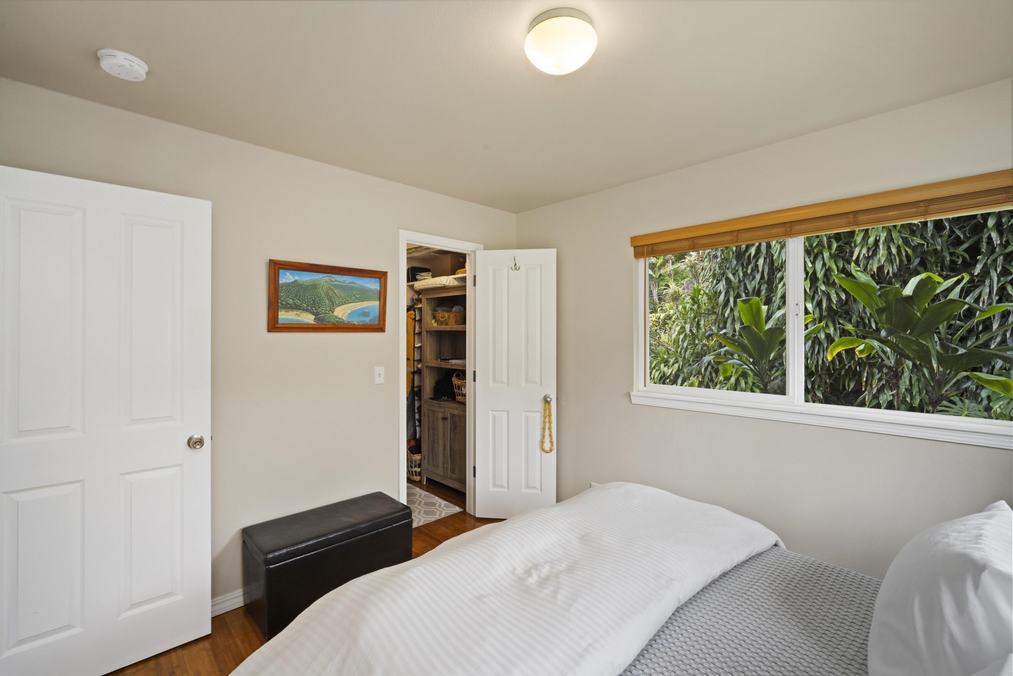 75 Ainakula Road, Unit A Kula, HI 96790 - Photo 18 of 45 a bedroom with a bed and a large window