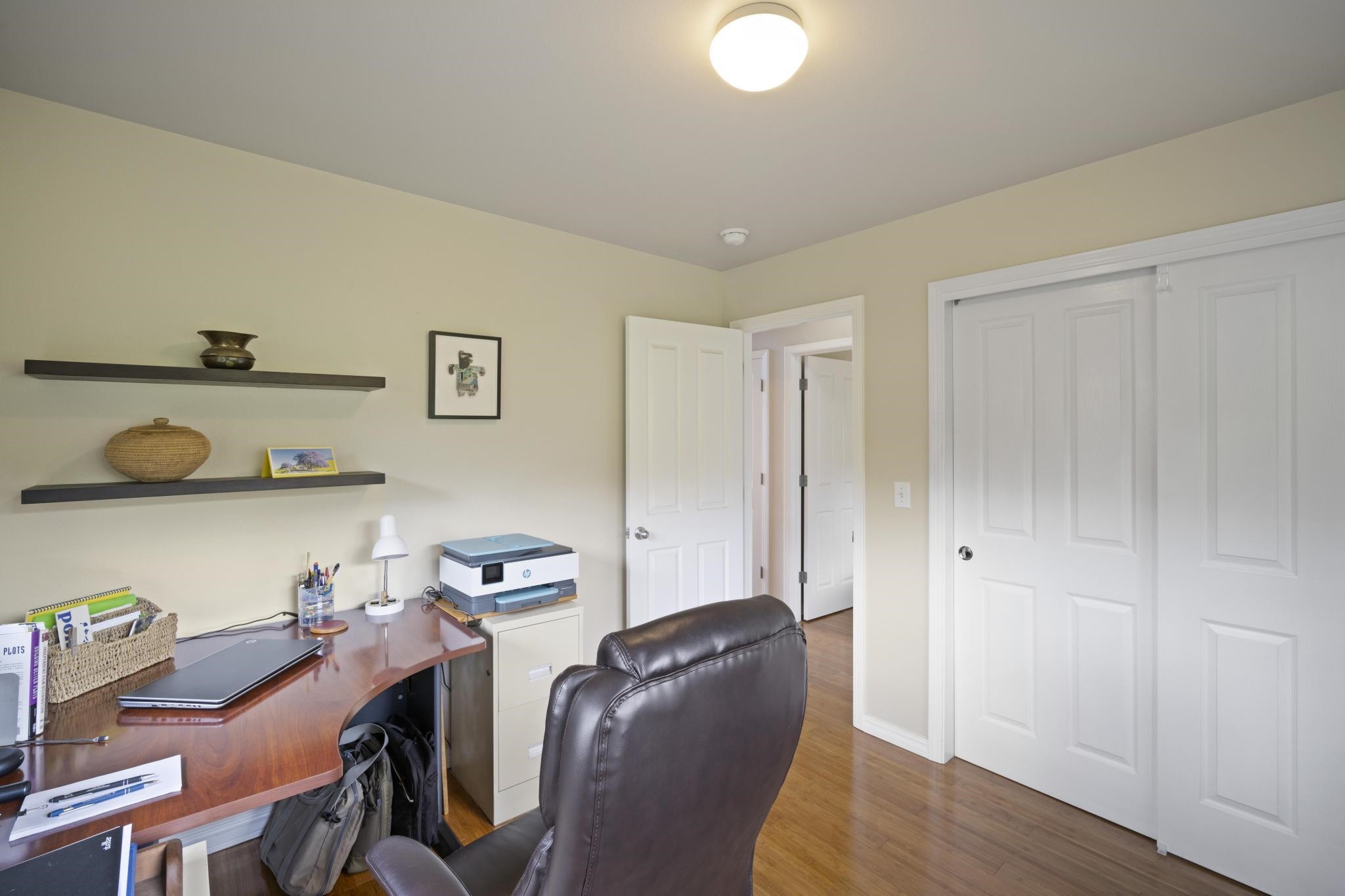 75 Ainakula Road, Unit A Kula, HI 96790 - Photo 23 of 45 a view of a workspace with furniture and wooden floor