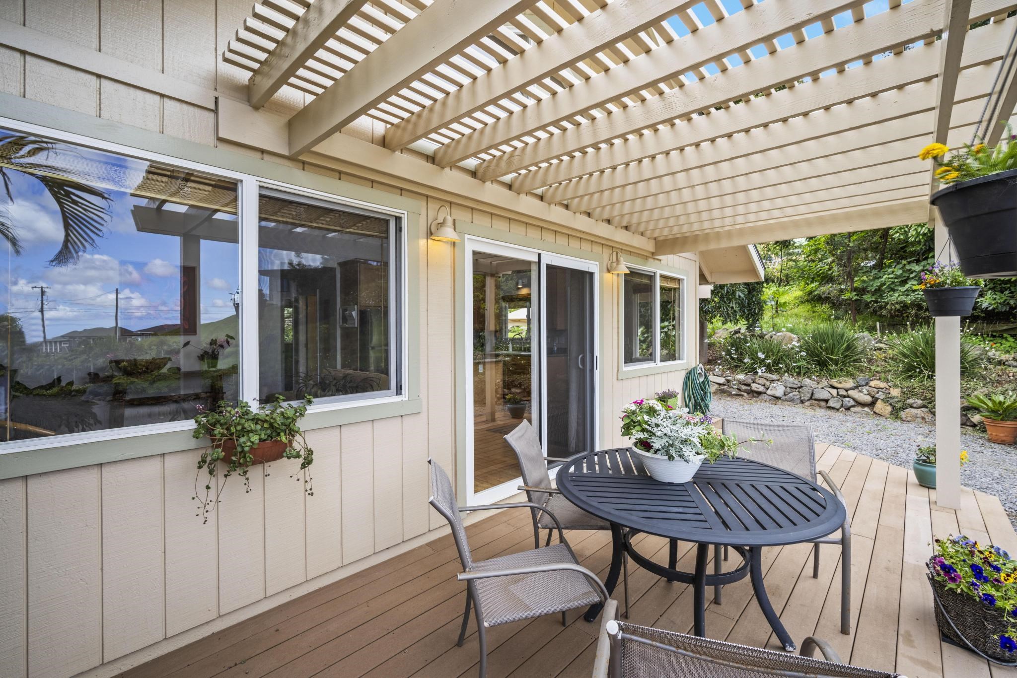 75 Ainakula Road, Unit A Kula, HI 96790 - Photo 25 of 45 a view of a house with a table and chairs in patio