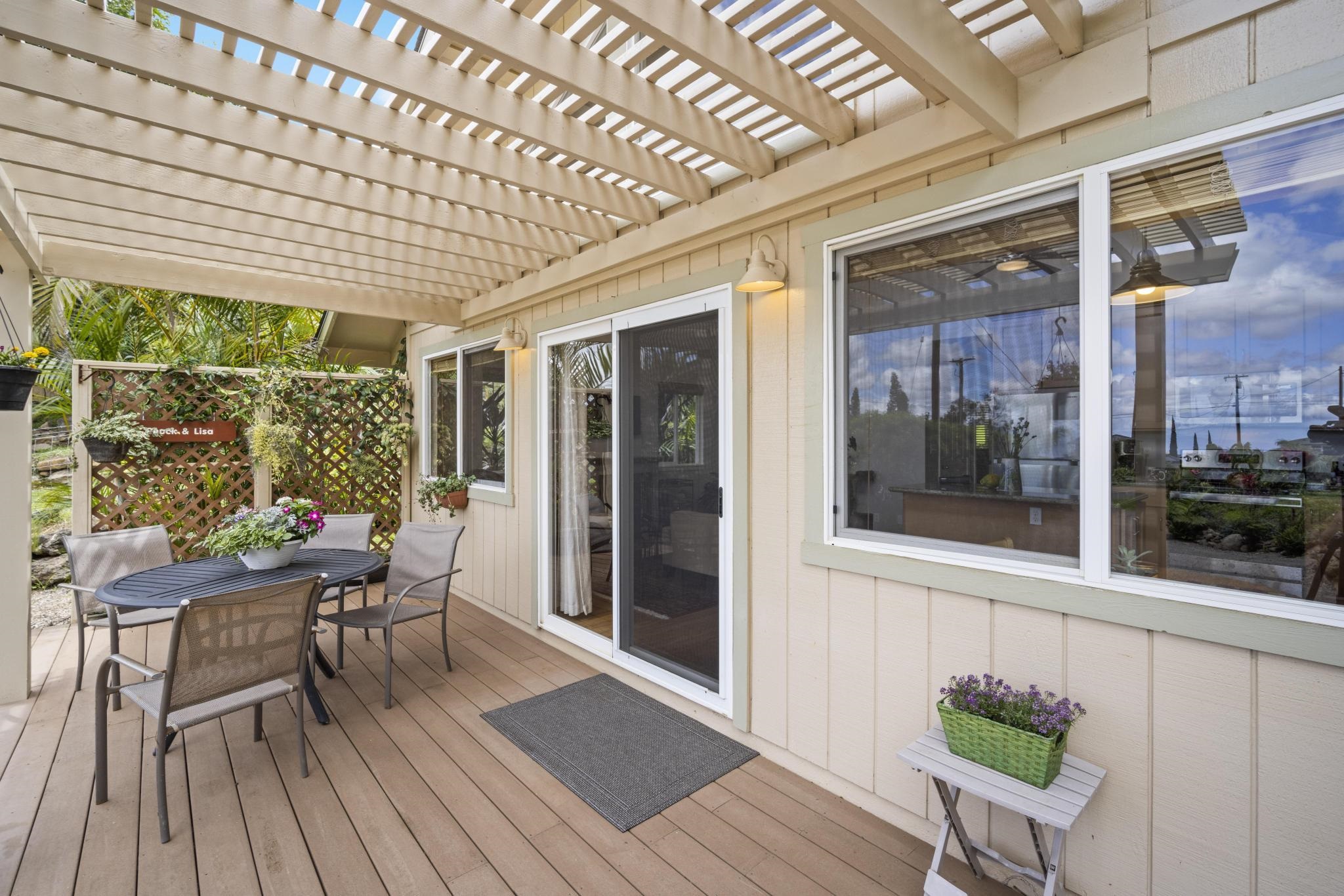 75 Ainakula Road, Unit A Kula, HI 96790 - Photo 26 of 45 a view of a patio with table and chairs and potted plants