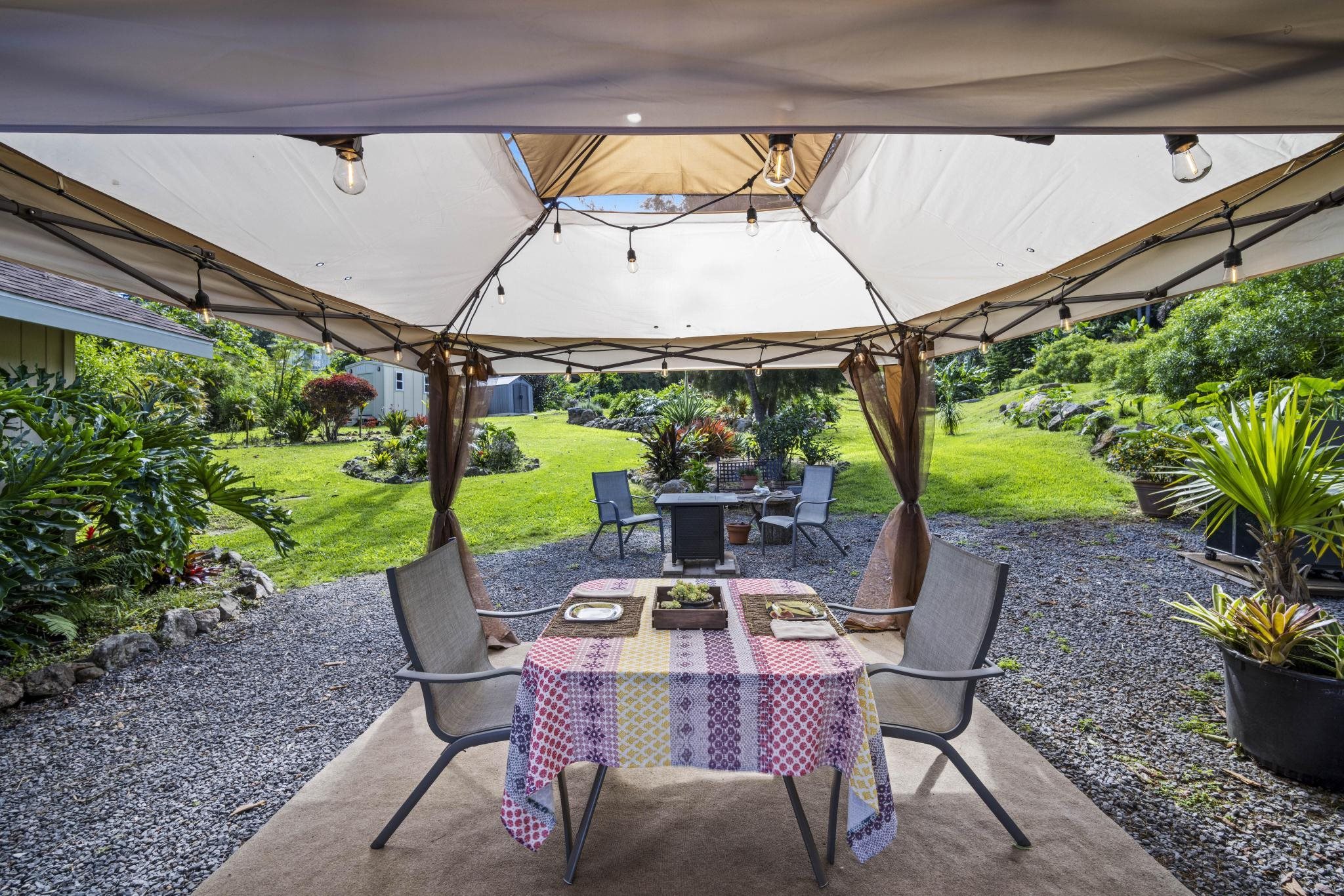 75 Ainakula Road, Unit A Kula, HI 96790 - Photo 33 of 45 a view of an outdoor sitting area with a table and chair