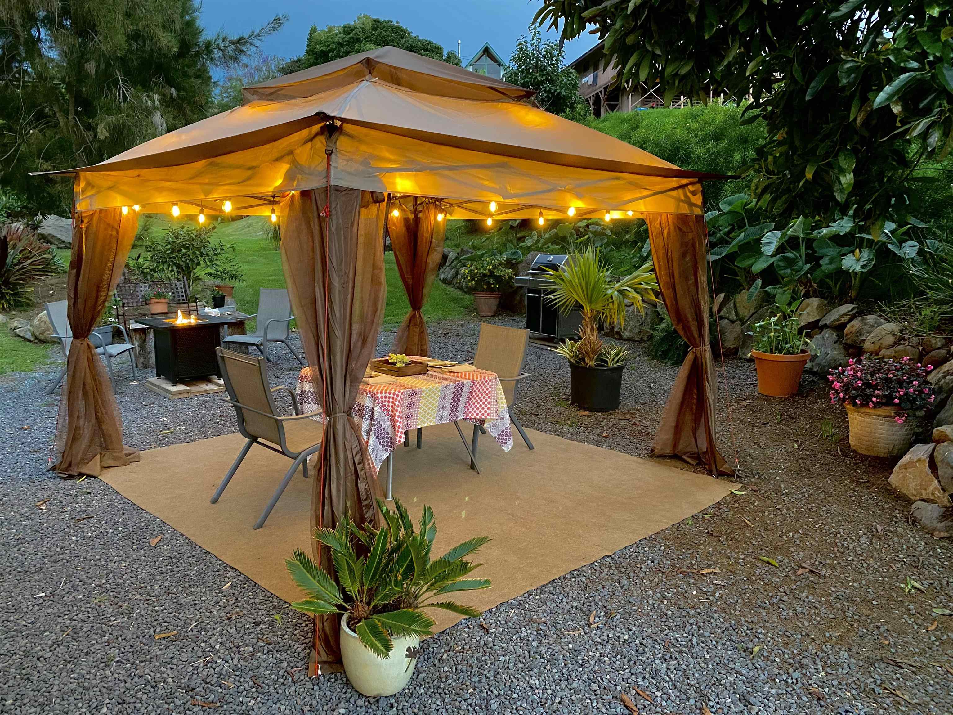 75 Ainakula Road, Unit A Kula, HI 96790 - Photo 5 of 45 a patio with table and chairs
