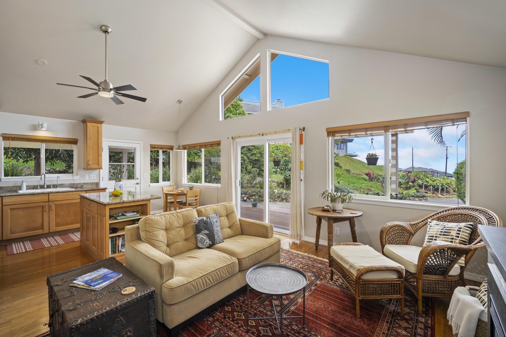 75 Ainakula Road, Unit A Kula, HI 96790 - Photo 9 of 45 a living room with furniture a flat screen tv and a large window