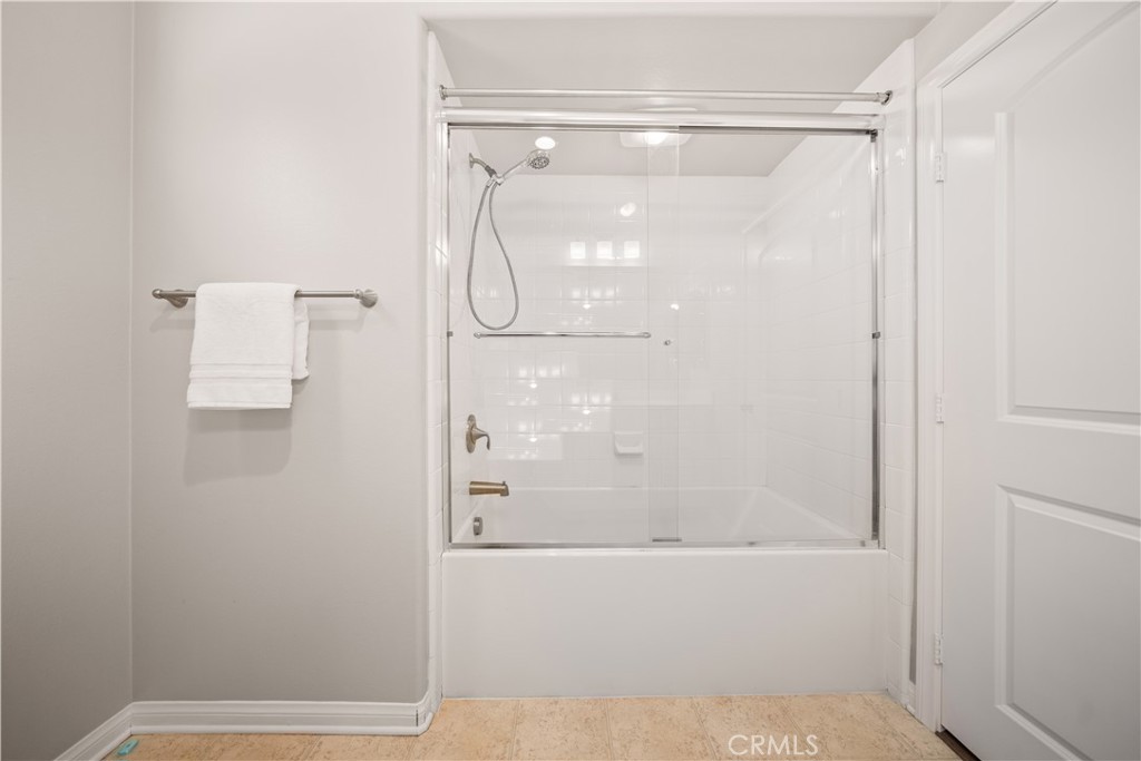 200 Rose Arch Irvine, CA 92620 - Photo 24 of 39 a bathroom with a glass shower door