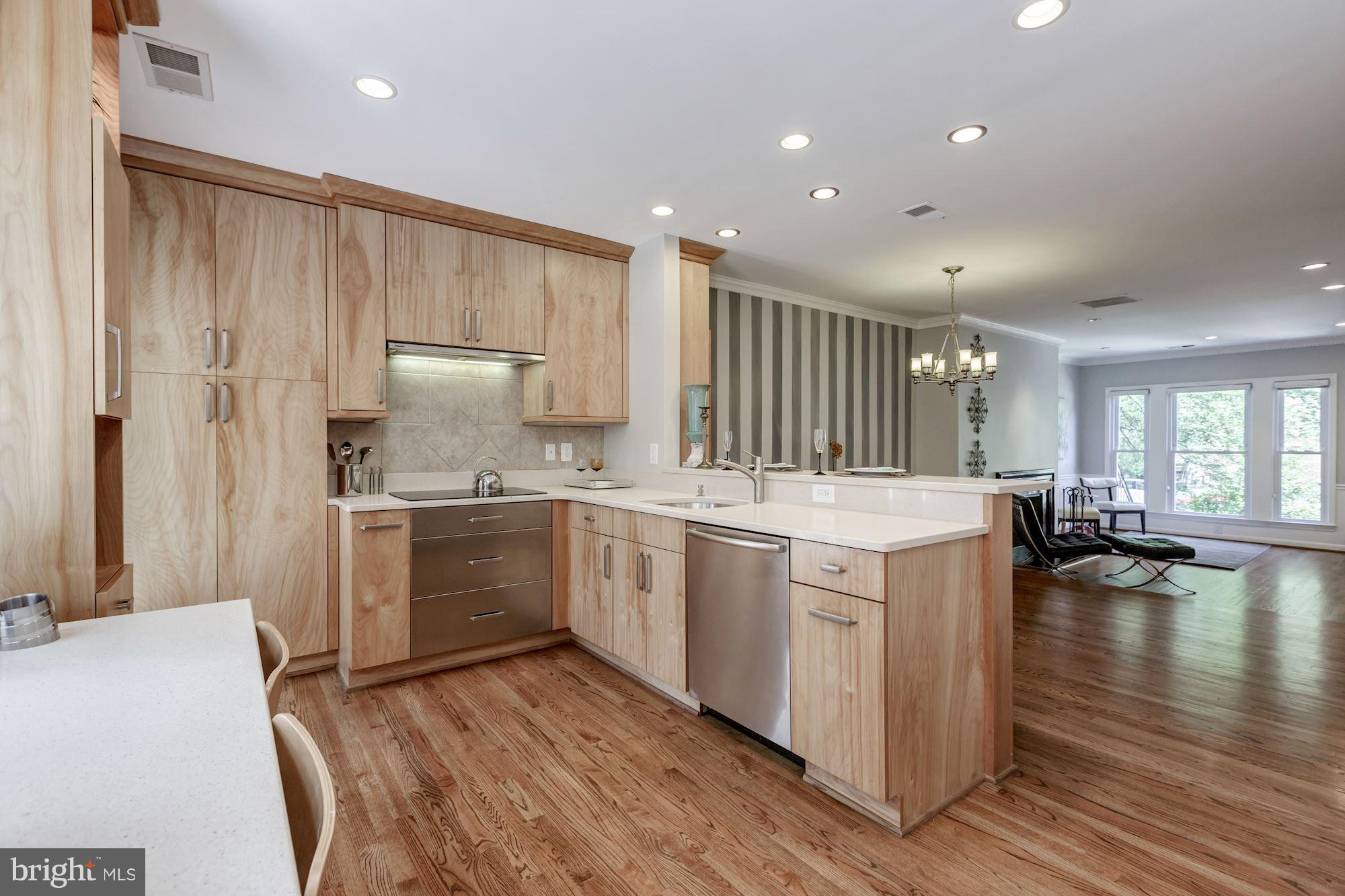 1910 17th Street Northwest Washington, DC 20009 - Photo 11 of 30 a kitchen with a sink stove and cabinets