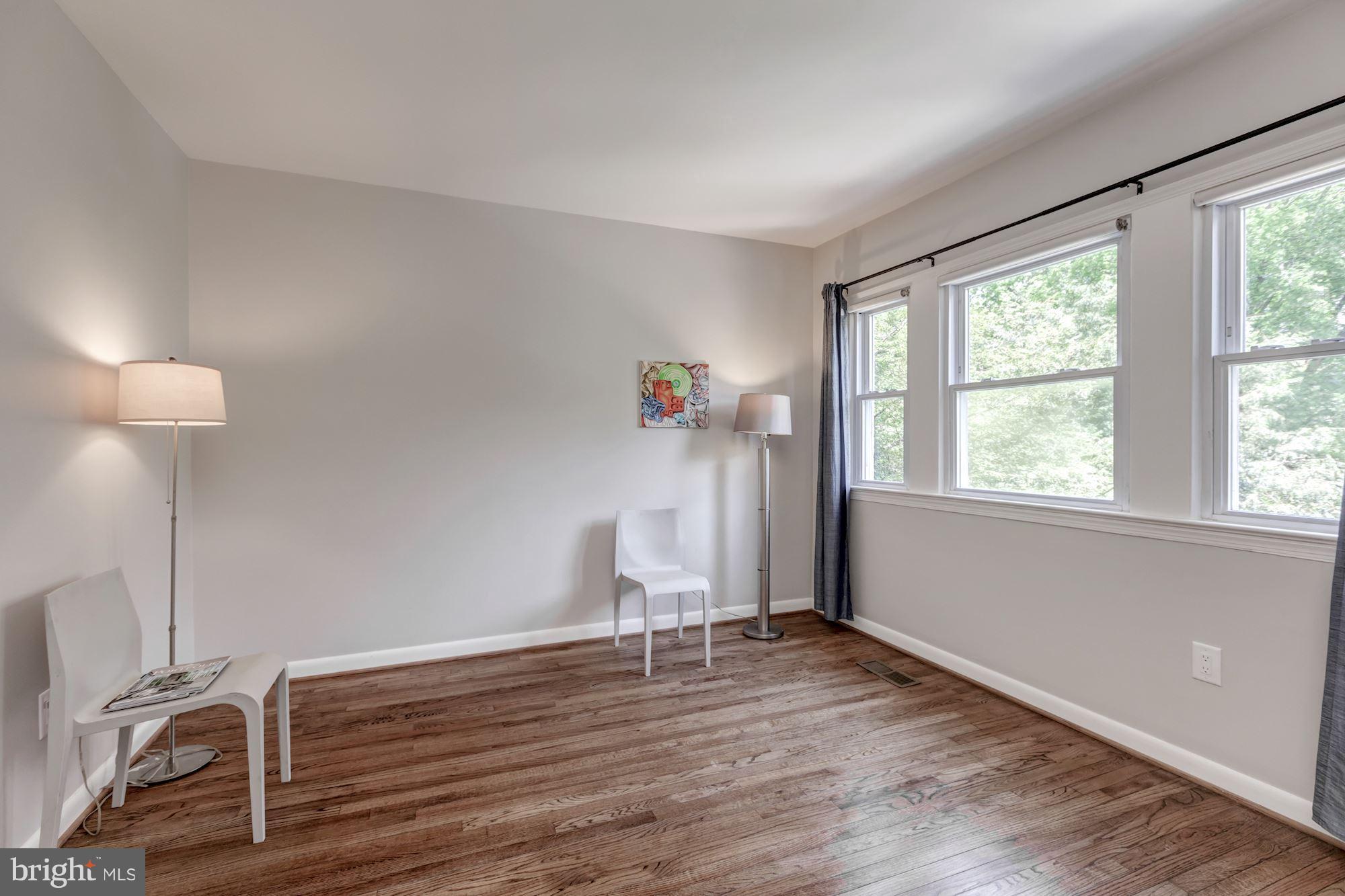 1910 17th Street Northwest Washington, DC 20009 - Photo 14 of 30 a room with a window and wooden floor